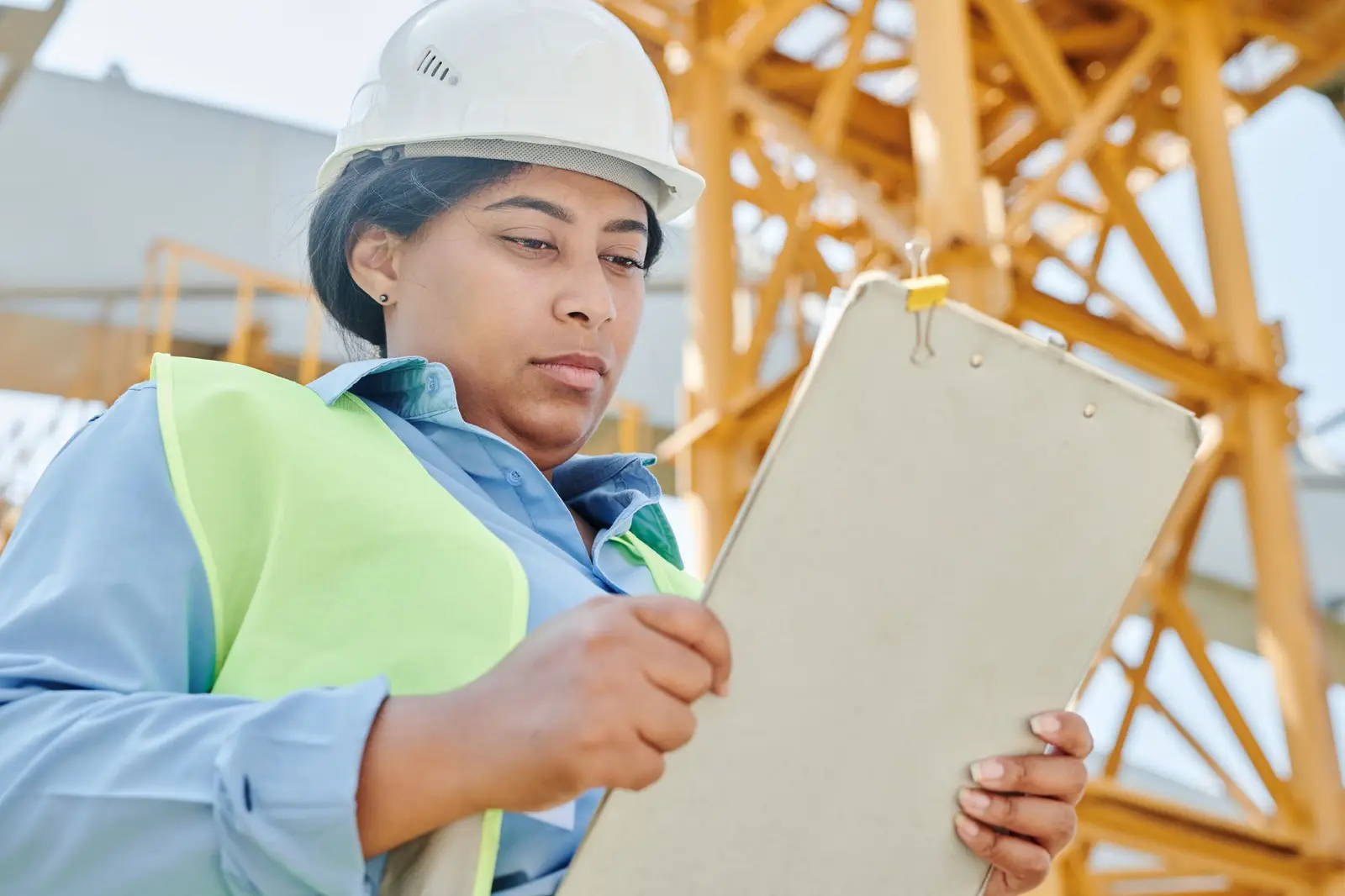 Engineer checking a site against an audit checklist