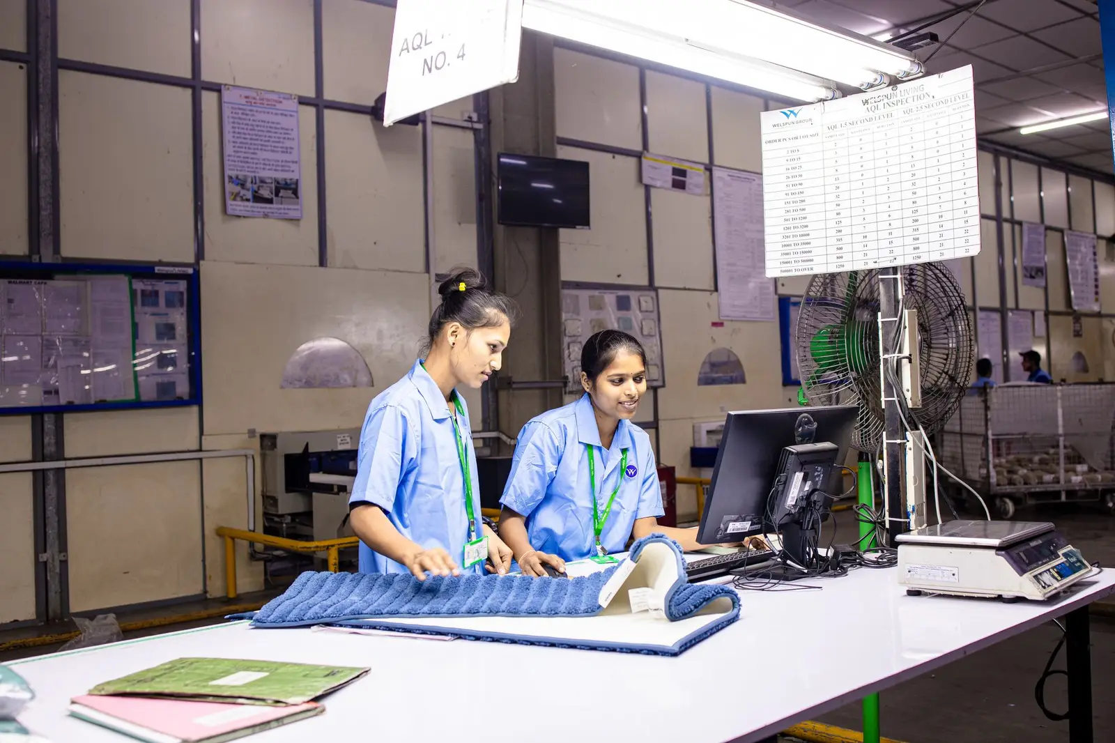 Quality inspectors checking products at an inspection station