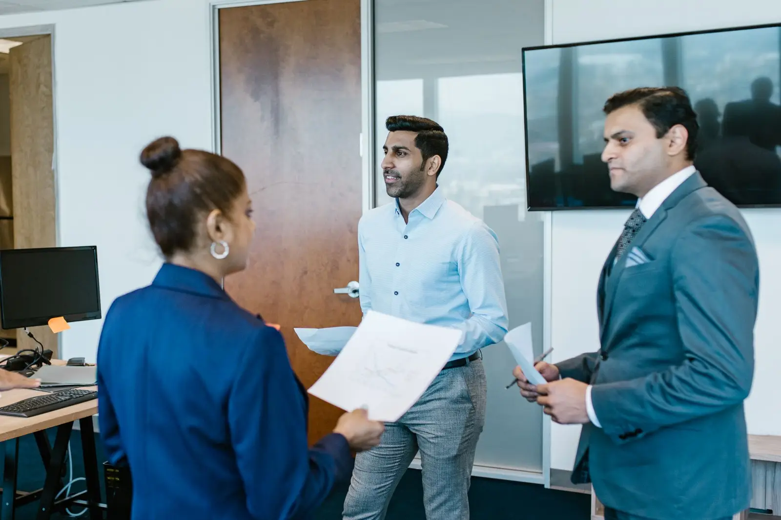 Consultants discussing a management system plan with a client team